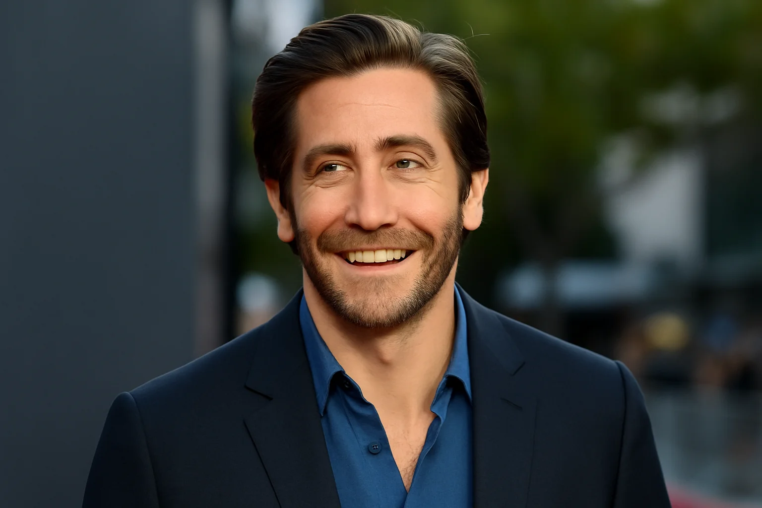 Jake Gyllenhaal smiling at a public event, representing his most memorable and career-defining Hollywood roles.
